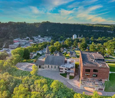 Scenic aerial view of Lanesboro, MN featuring lush greenery and historic buildings.